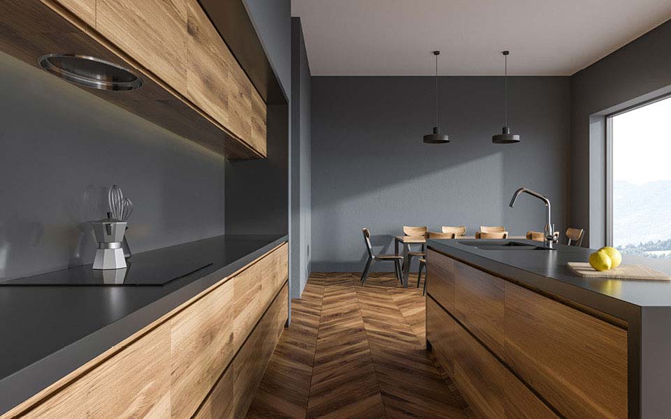 puristische Massivholzküche mit grauen Wänden und Küchenblock mit integriertem Spülbecken | Möbeltischlerei woodendesign aus Hamburg